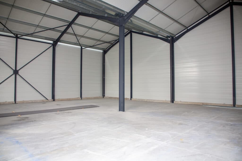 interior of empty garage with concrete flooring