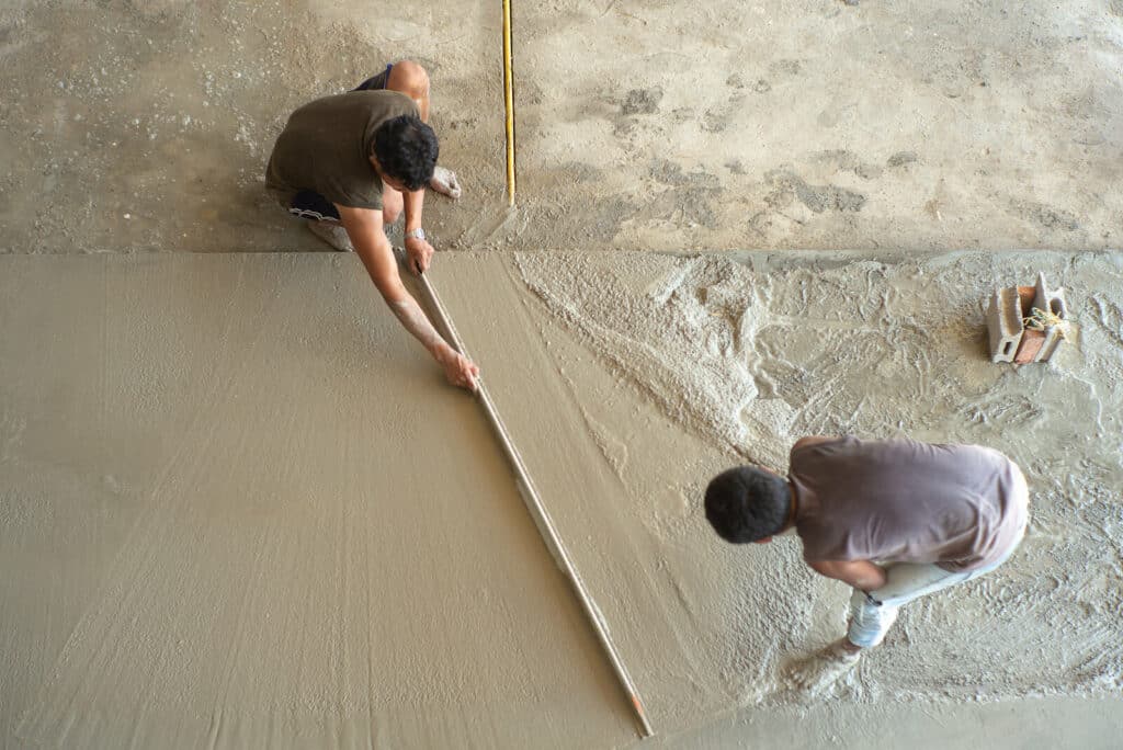 Top view of workers laying concrete